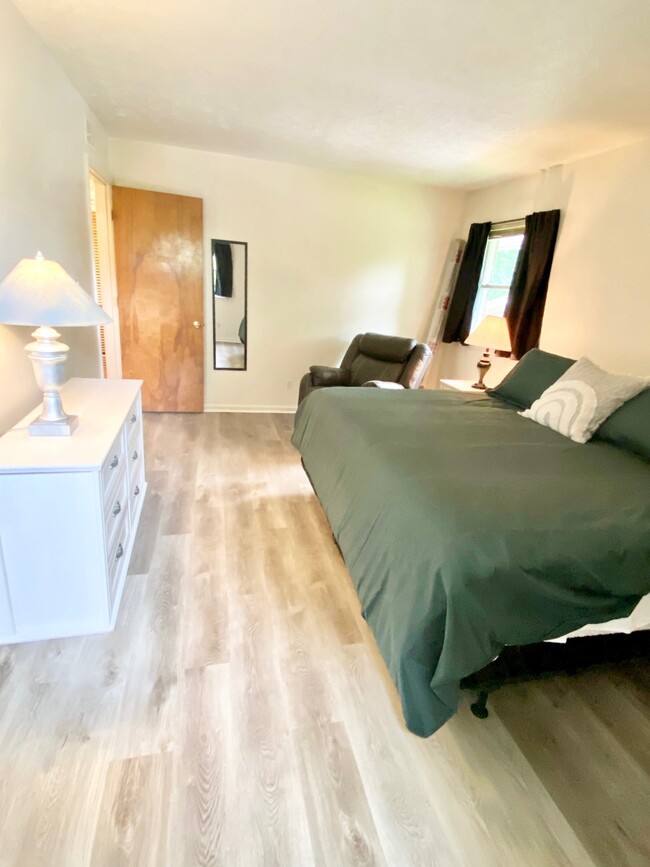 Large bedroom with king bed - 145 E Wellington Ave