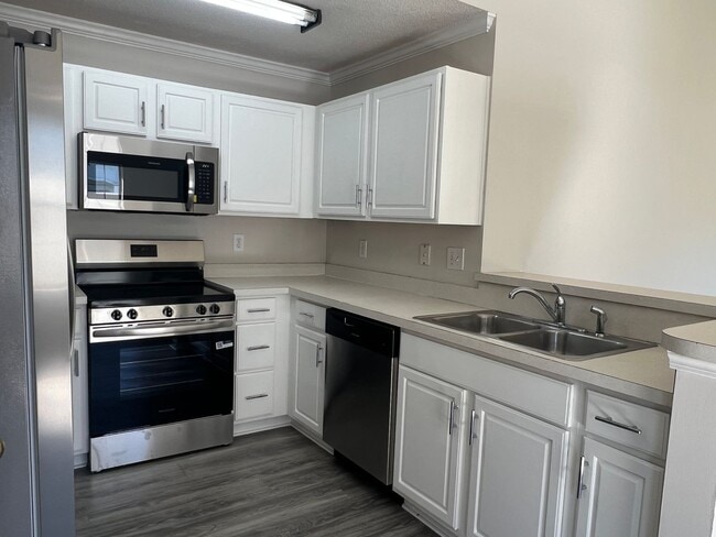 Photo - ONE MONTH FREE with an eighteen-month lease. Spacious, Three-Bedroom Home with Fenced Yard! Just ...