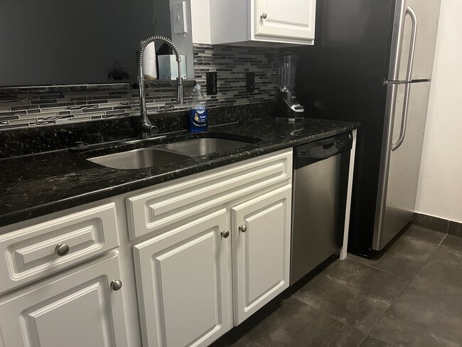 Kitchen with stainless steel appliances - 1810 E Palm Ave