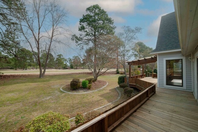 Private back deck with direct access from the primary suite. - 6812 Uppingham Rd