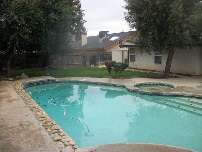 Building Photo - Coming Soon: Spacious Renovated 3 Bedroom Rosedale Home with Pool, Dual Fireplaces & Covered Patio