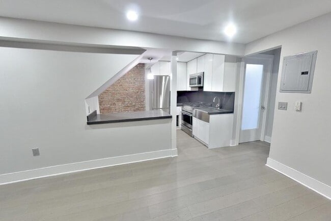 Photo - 411 E 12th St Apartment