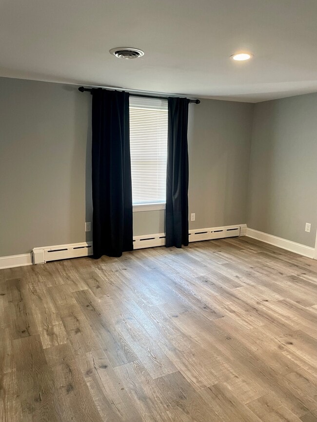 Bedroom with blackout curtains included - 1718 Grace Ave