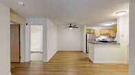 Located at 529 Sandpiper Ln in Wadsworth, Ohio, this 2-bedroom, 2-bathroom residence offers a thoughtfully designed single-floor layout with a clean, neutral aesthetic throughout. Hardwood-style flooring runs seamlessly across the living areas, complementing the bright white walls and creating a cohesive, welcoming atmosphere.

The open-concept kitchen and living room form the heart of the home. The kitchen features light wood cabinetry, dark granite-style countertops, stainless steel appliances including a refrigerator and range, and a peninsula that opens to the living area. The living room is bathed in natural light thanks to large sliding glass doors with vertical blinds that lead to a private balcony overlooking mature trees.

Both bedrooms are well-proportioned and finished with hardwood-style flooring and ceiling fans. The primary bedroom benefits from generous natural light through a large window with a leafy outdoor view. A spacious walk-in closet with wire shelving provides ample storage. One bathroom includes a tub/shower combination, a wood-vanity, and tiled flooring, with a stacked washer and dryer conveniently located nearby. The second bedroom also features access to a walk-in closet. This residence offers practical, comfortable living in a serene Wadsworth setting.