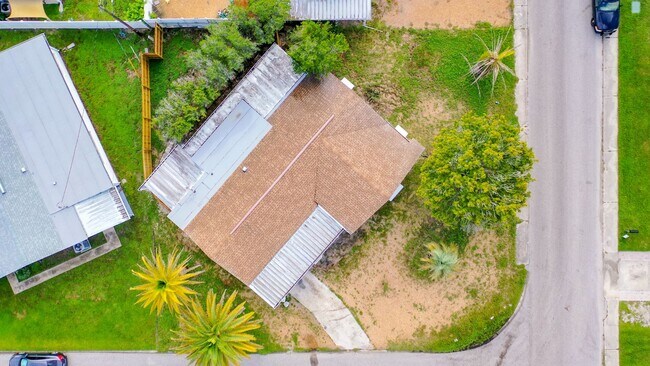 Building Photo - 2/2/1 with  RENOVATED baths & kitchen, fenced yard, NEW lvp flooring and a OVERSIZED lanai!