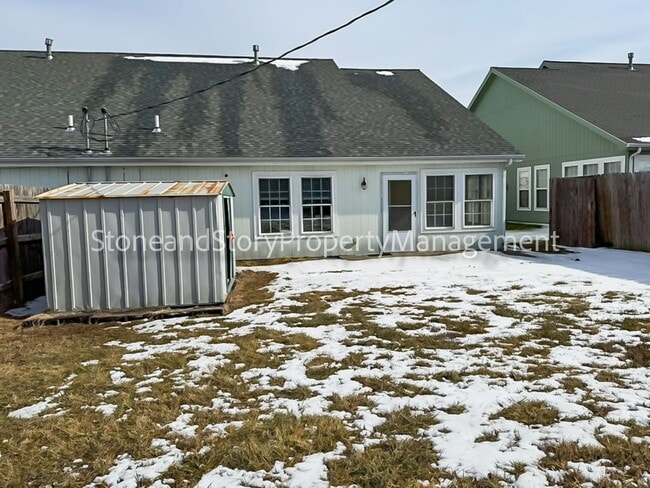 Building Photo - 2 bedroom 1.5 bath duplex with sunroom, 2 car garage and fenced yard