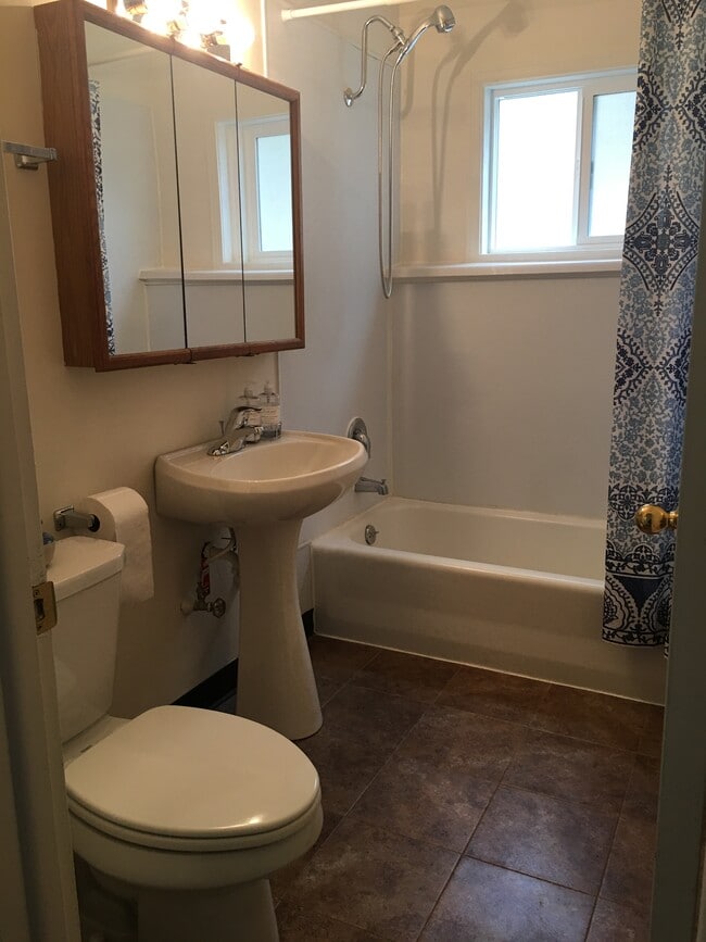 Bath with tub/shower. - 115 N Main St