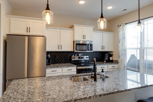 Granite countertops and stainless steel appliances. - 6063 Hillside Ln