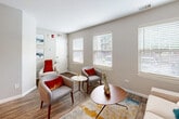 Located at 896 Benedetti Dr in Naperville, IL, this well-designed one-bedroom, one-bathroom unit offers a thoughtful layout across a single floor. The open-concept living and kitchen area serves as the heart of the home, where rich hardwood-style flooring flows throughout. Multiple windows dressed with blinds invite abundant natural light, creating a bright and welcoming atmosphere. The living area provides generous space for seating arrangements, complemented by neutral wall tones that lend a clean, modern aesthetic.

The kitchen features white cabinetry, granite countertops, stainless steel appliances, and a peninsula with bar seating — ideal for casual dining. A dedicated dining nook with additional wall shelving adds practical charm to the culinary space.

The bedroom is carpeted for comfort and includes a ceiling fan, a natural-light window, and access to a spacious walk-in closet outfitted with wire shelving along multiple walls, offering ample storage capacity.

The bathroom is finished with granite countertops, white shaker-style cabinetry, wood-look tile flooring, and a full tub-shower combination with classic white tile surround. Every detail in this Naperville unit reflects a clean, contemporary design with functional living in mind.