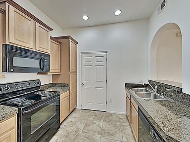 Kitchen with W&D - 14575 W Mountain View Blvd