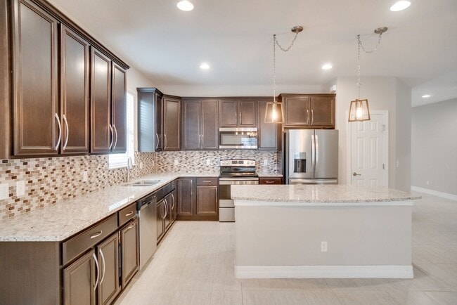Building Photo - Stunning 3-Bedroom Pool Home with Bonus Room in the Gated Community of Lakeshore at Narcoossee