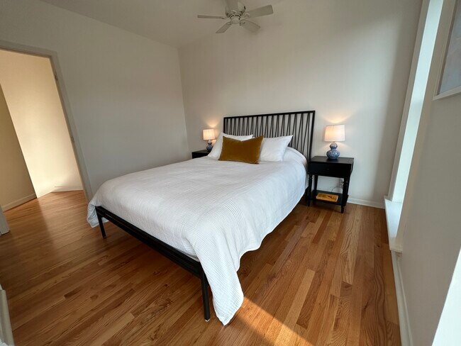 Cozy bedroom space fits a Queen or King size bed. - 165 Western Ave N