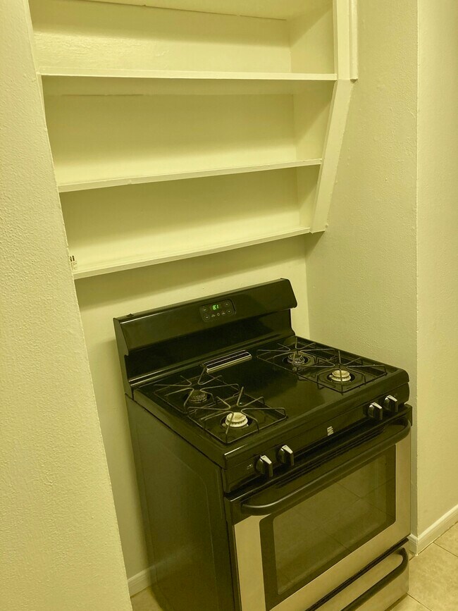 Gas stove with storage above - 3817 S Shepherd Dr