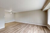 Located at 38001 Club House Ln in Harrison Township, MI, this single-floor, one-bedroom, one-bathroom unit offers a well-organized layout designed for comfortable everyday living. The open living room greets you with light wood-look flooring, neutral warm-toned walls, a textured ceiling, and a ceiling fan that enhances airflow throughout the space. Large windows with vertical blinds allow natural light to fill the room. A dedicated dining area flows seamlessly from the living space, creating an open and connected feel. The kitchen is thoughtfully appointed with rich dark cabinetry, light countertops, stainless steel appliances including a refrigerator, dishwasher, and range, and matching wood-look flooring. The bedroom features plush carpeting, a large window for natural light, and direct access to a spacious closet. Two additional closets throughout the unit provide generous storage. The full bathroom includes a combined tub and shower, a vanity with dark cabinetry and stone-look countertop, and wood-look flooring. A dedicated in-unit laundry area houses a full-size washer and dryer, adding everyday convenience. The overall ambiance is clean, modern, and move-in ready.