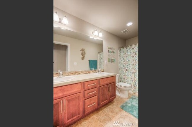 Bath on upper floor for bedrooms 2 &amp; 3. - 8828 Jayden Ln NE