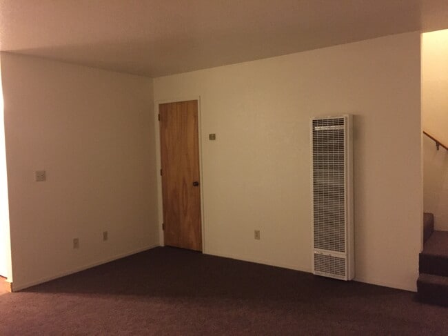 living room with closet under stairs - 1615 C St