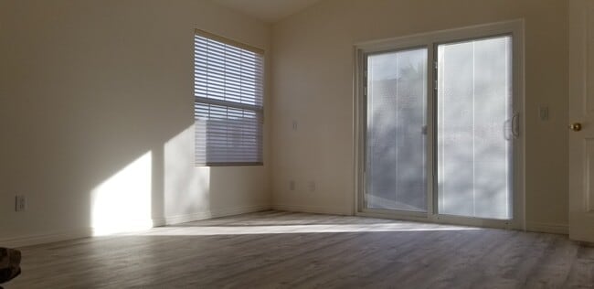 2. East-facing living room north end (garden views + double sliding patio door with privacy blinds) - 137 E 755 S