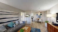 Located at 2001 Piner Road in Santa Rosa, CA, this single-floor, 2-bedroom, 2-bathroom residence offers a thoughtfully designed layout that maximizes functionality and comfort. Light-toned walls, wood-style flooring, and textured ceilings flow throughout the main living areas, creating a cohesive and welcoming atmosphere.

The open-concept living and dining area serves as the heart of the home, with the living room featuring a sliding glass door that leads to a private balcony with outdoor views. The adjacent dining area is defined by a ceiling fan and connects seamlessly to the kitchen via a pass-through window. The kitchen is fitted with white shaker-style cabinetry, stone-look countertops, a stainless steel dishwasher, and ample storage — a practical and clean space for cooking.

Both bedrooms are carpeted for comfort, with the primary bedroom offering generous proportions and a dedicated closet. Each bedroom benefits from natural light through sizable windows. The two bathrooms are finished with white vanity cabinetry, stone-look countertops, and wood-style flooring — one featuring a tub-shower combination. Additional conveniences include in-unit laundry and hallway access connecting all rooms efficiently throughout the single-level floor plan.