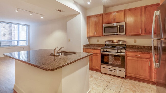 Kitchen with Island and Stainless Steel Appliances - The Veridian