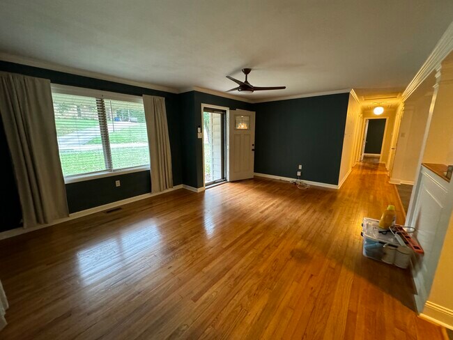Sunny front room with original hardwood floors. - 3708 Idlewild Ave