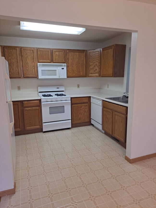 Large Kitchen with Microwave, dishwasher, stove, and garbage disposal. - 5727 W Barton St