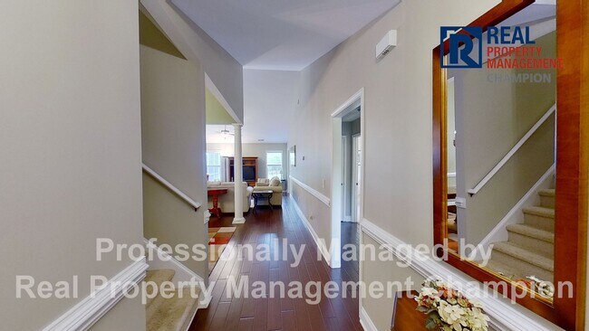 Building Photo - Beautiful home boasts open floorplan, screened porch, and spacious fenced yard