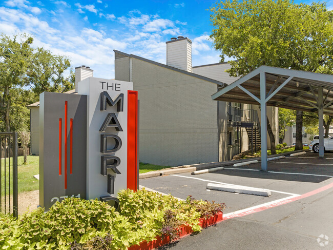 Entrance Sign and Covered Parking - The Madrid