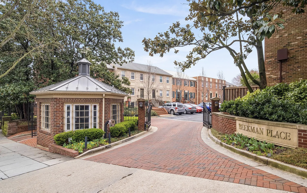 Gated entry to apartment complex with 24-hour security. - 1636 Beekman Pl NW