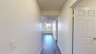 Located at 7555 E Warren Dr in Denver, CO, this single-floor residence offers three bedrooms, two bathrooms, and a thoughtfully designed layout. The open living room is a standout space, featuring rich wood-look flooring, a classic brick fireplace, and multiple windows that invite abundant natural light. A ceiling fan adds comfort, and a sliding glass door leads directly to a private balcony with tree-lined views — ideal for enjoying Colorado's seasonal scenery.

The galley-style kitchen is well-equipped with rich cherry wood cabinetry, granite-style countertops, and stainless steel appliances including a refrigerator, electric range, dishwasher, and built-in microwave. A window above the sink brings in additional natural light.

The bedrooms are generously sized, with the primary bedroom offering a ceiling fan, sliding glass balcony access, and ample natural light. Additional bedrooms feature plush carpeting and bright windows. Both bathrooms are finished with wood-look flooring, rich cabinetry, granite-style countertops, and tiled shower-tub combinations.

A dedicated laundry area houses a full-size washer and dryer, adding everyday convenience. Throughout the home, textured ceilings and clean white walls create a bright, neutral backdrop, making this a comfortable and functional Denver residence.