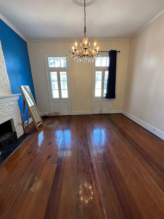 Living room leading to balcony - 821 Barracks St Apartments