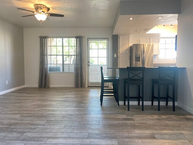 Open concept living/dining room with stools - 5950 N 78th St