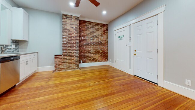 Real Hardwood floors, exposed brick - 2742 Saint Paul St