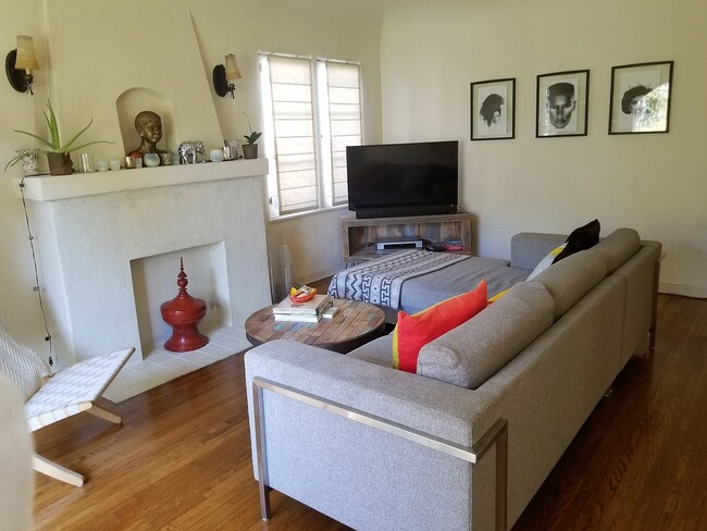 living room with fireplace and hardwood floors - 1362 S Mansfield Ave