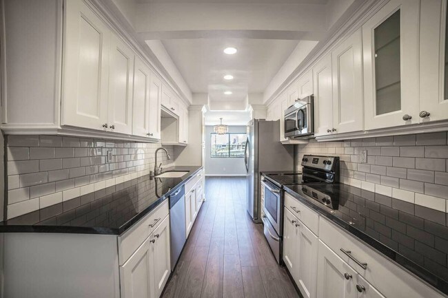 Cook’s kitchen with Kohler farmhouse sink - 1032 N Sweetzer Ave