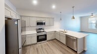 This 630 square foot apartment in Cedar Rapids, Iowa, offers a thoughtful blend of comfort and functionality. The single-floor layout maximizes space efficiency, featuring one bedroom and one bathroom. The bedroom, measuring 140 square feet, provides ample space for rest and relaxation.

The heart of the home is the modern kitchen, equipped with stainless steel appliances, including a built-in microwave and dishwasher. Light-colored cabinetry and quartz countertops create a bright, clean aesthetic. The L-shaped design offers generous counter space and storage.

Throughout the apartment, neutral tones and contemporary finishes create a fresh, inviting atmosphere. The bathroom boasts a sleek vanity with ample storage and a large mirror. Wood-look vinyl flooring in the kitchen and living areas contrasts nicely with the plush carpeting in the bedroom.

Large windows allow natural light to flood the space, while modern ceiling fans provide air circulation and ambient lighting. The open-concept design seamlessly connects the living areas, creating a sense of spaciousness. Built-in closets offer practical storage solutions.

Located at 900 3rd St SE in Cedar Rapids, this apartment combines urban convenience with modern comfort, ideal for those seeking a stylish, low-maintenance living space.