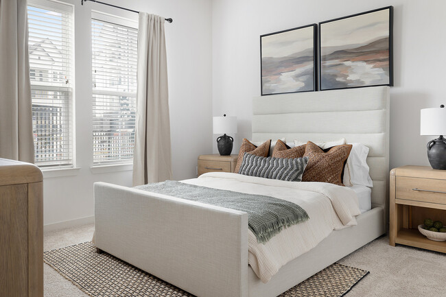 Experience serenity in this beautifully designed modern bedroom, complete with chic accents. - Livano Springdale