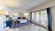 Located at 4 Deauville Ct in Pikesville, MD, this well-appointed single-floor residence offers 1 bedroom and 2 bathrooms across a generously proportioned layout. Light-toned hardwood-style flooring runs throughout, creating a cohesive and airy feel from room to room.

The living room is a standout space, anchored by a set of elegant French doors that flood the area with natural light and provide direct access to an outdoor balcony. The open flow between the living and dining areas makes the combined space feel expansive and well-suited for both everyday living and entertaining.

The kitchen features warm honey-toned wood cabinetry, ample counter space, a gas range, and full-size appliances, providing a functional and practical cooking environment.

The primary bedroom is notably spacious, with large windows that invite natural light and offer a calm, restful atmosphere. A second bedroom provides additional flexibility for guests or a home office, also featuring generous window coverage.

Two bathrooms serve the residence — one with a tiled tub-shower combination and wood vanity, and a second with a glass-enclosed walk-in shower. A dedicated closet offers practical storage solutions. Throughout the home, neutral walls and consistent flooring create a clean, welcoming ambiance.