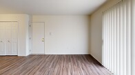 This 670 square foot apartment in Clinton Township, MI, offers a well-designed living space with two bedrooms and one bathroom. The single-story layout maximizes efficiency, featuring a combined kitchen and living area that creates an open, airy feel. The primary bedroom, at 130 square feet, provides ample space for comfort.

Throughout the apartment, modern wood-look flooring adds warmth and durability. Large windows, including sliding glass doors in the main living area, allow natural light to flood the space, enhancing its open atmosphere. The kitchen is equipped with essential appliances, including a dishwasher, and features contrasting dark cabinets with light countertops for a contemporary look.

Both bedrooms offer closet space with sliding doors, ensuring adequate storage. The bathroom, while compact, includes a shower/tub combination with tiled walls for a clean, low-maintenance design. The apartment's neutral color palette provides a blank canvas for personal decorating styles.

This apartment balances functionality with modern aesthetics, making efficient use of its 670 square feet to create a comfortable living environment suitable for small families or individuals seeking a well-appointed space in a convenient location.