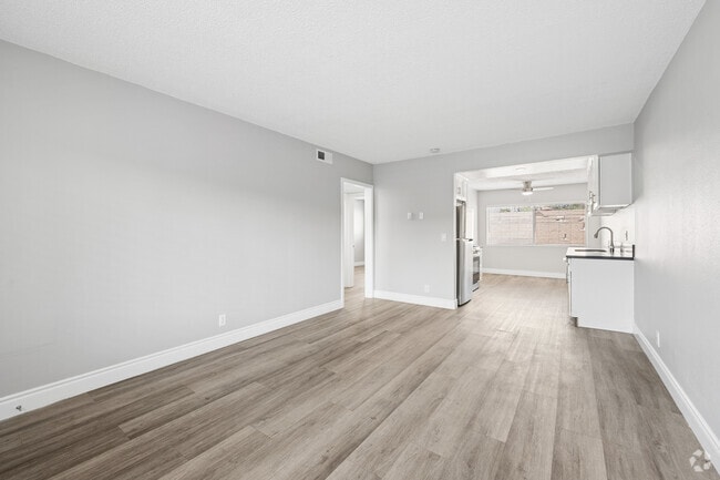 2BR, 1BA - 865SF - Living Room - Palm View Apartments in Azusa