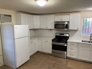 Remodeled kitchen with stainless steel stove and microwave - 3727 46th St