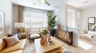 Located in Phoenix, AZ, this thoughtfully designed 2-bedroom, 3-bathroom residence offers a comfortable and modern living experience across a single floor. The open-concept living room is bright and welcoming, featuring large windows that flood the space with natural light, light wood-style flooring, and a ceiling fan overhead. The kitchen is a standout, showcasing crisp white shaker cabinetry, dark granite countertops, subway tile backsplash, stainless steel appliances, and a peninsula with bar seating illuminated by pendant lighting — ideal for entertaining. A sliding barn door adds a charming architectural accent to the space. The primary bedroom offers a comfortable retreat with a spacious sliding-door closet and natural light streaming through window treatments. The additional bedroom is equally well-appointed with ample natural light and closet space. The bathrooms are elegantly finished, including a walk-in shower with floor-to-ceiling marble-style tile and a glass enclosure, alongside a vanity with granite countertops and white cabinetry. A dedicated in-unit laundry room with a full-size washer and dryer adds everyday convenience. Throughout the home, consistent wood-style flooring and a neutral color palette create a cohesive, modern aesthetic.