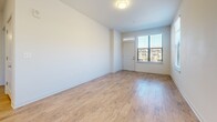 Located at 786 Parker Forest Dr in Dawsonville, GA, this well-appointed one-bedroom, one-bathroom unit offers a thoughtfully designed single-floor layout with a clean, modern aesthetic. Light wood-style flooring runs throughout the entire space, complementing the crisp white walls and creating a bright, cohesive atmosphere.

The open-concept kitchen and living area serves as the heart of the unit. The kitchen is equipped with stainless steel appliances, including a range, microwave, and refrigerator, alongside gray shaker-style cabinetry, white quartz countertops, and a classic subway tile backsplash. A kitchen island with an undermount sink and pendant lighting above adds both functionality and style. Multiple windows allow natural light to fill the space.

The living area is an open, airy space with a flush-mount ceiling light and a front entry door flanked by a window, offering views of the surrounding community. The bedroom is a comfortable, well-lit room featuring two windows, a ceiling fan, and access to a dedicated closet. The bathroom is finished with matching gray cabinetry, a white countertop vanity, a large mirror with overhead lighting, and wood-style flooring that ties seamlessly to the rest of the unit.