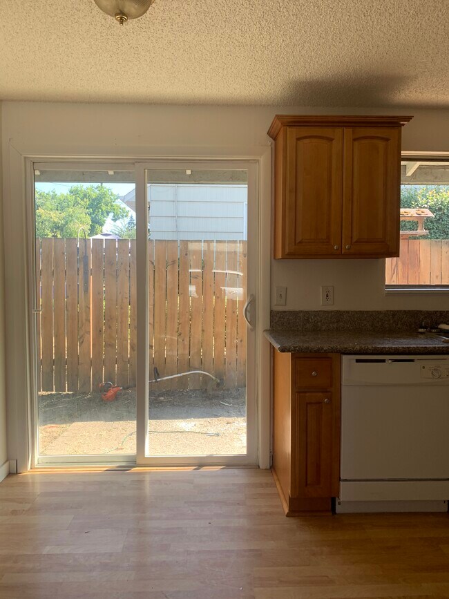 Sliding door open to a nice backyard - 9951 N Van Houten Ave