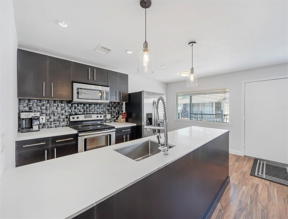 Fully updated kitchen with plenty of natural light and counter/bar space - 309 Stratford St