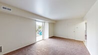 Located at 1600 Laurel Rd in Lindenwold, NJ, this two-bedroom, one-bathroom residence offers a practical and well-organized single-floor layout. The living room is generously sized, featuring warm wall-to-wall carpeting and a sliding glass door fitted with vertical blinds that opens to an outdoor balcony — offering views of the community pool and surrounding greenery, bringing in abundant natural light.

The kitchen is efficiently designed with ample warm-toned wood cabinetry, dark granite-style countertops, and light ceramic tile flooring. It comes fully equipped with a gas range, dishwasher, and refrigerator, providing everything needed for daily meal preparation.

The spacious primary bedroom features plush carpeting, two windows that invite natural light, and a dedicated closet for storage. The second bedroom, also carpeted, offers a comfortable and versatile space. A tiled hallway with a sliding-door closet connects the main living areas, adding practical storage to the layout.

The full bathroom includes a tub-shower combination with tiled surround and a grab bar, accented by mosaic tile flooring. Throughout the unit, neutral cream-toned walls provide a clean, move-in-ready backdrop adaptable to any décor style.