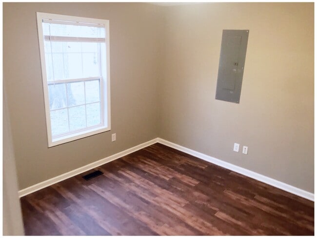 Bedroom 3 freshly painted and new flooring. - 216 Winters St