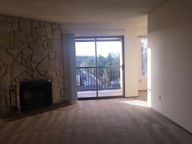 Building Photo - Clean Top Floor 1BR 1BA Condo with Wood Burning Fireplace