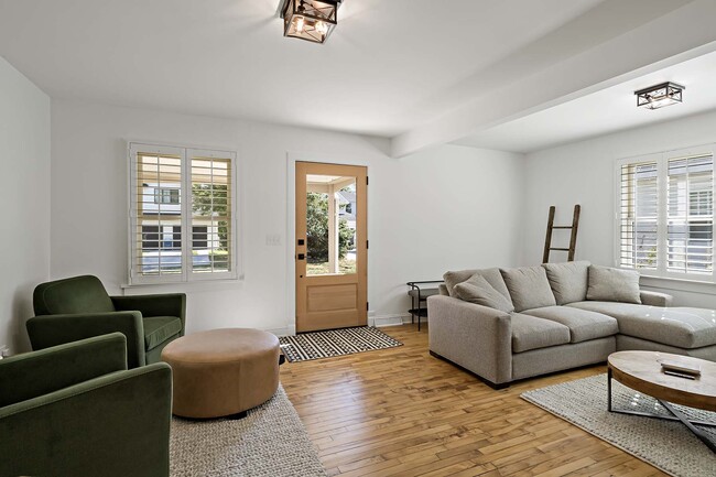 Glass front door and plenty of windows to let in natural light - 129 Chicago Ave N