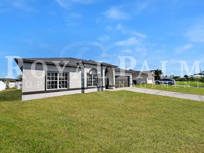 Building Photo - 3BR/2BA Home Ready to Bloom in Lehigh Acres + GARAGE!!
