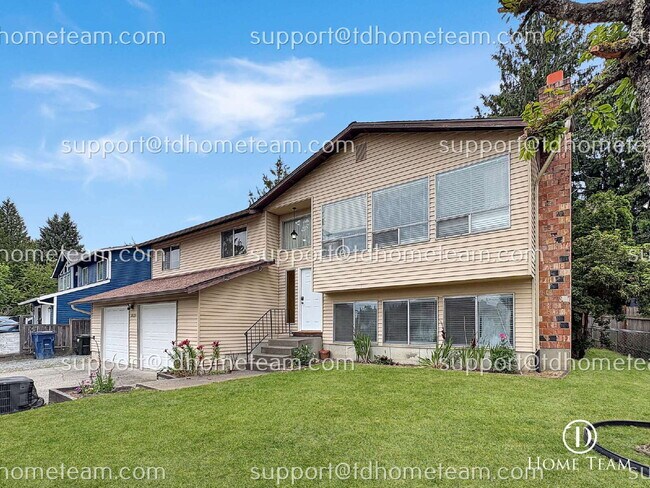 Foto del edificio - "Spacious 4-Bed Oasis with Granite Touches & Finished Basement in Renton!"